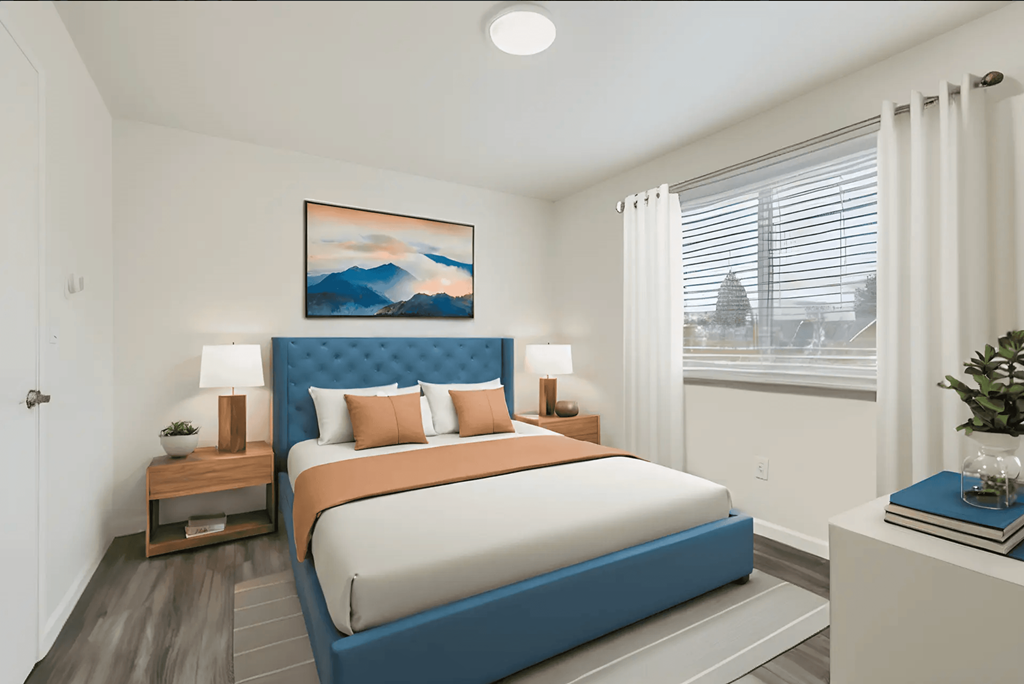 a bedroom with a bed and a window