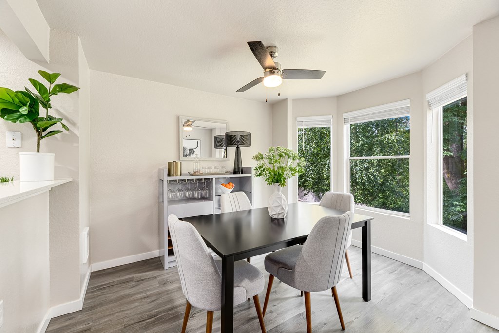 a dining room with a table and chairs