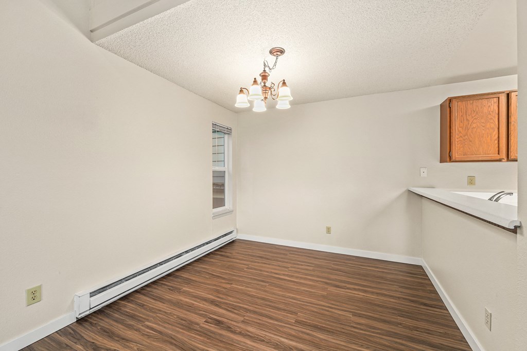 the spacious living room and kitchen of our studio apartments