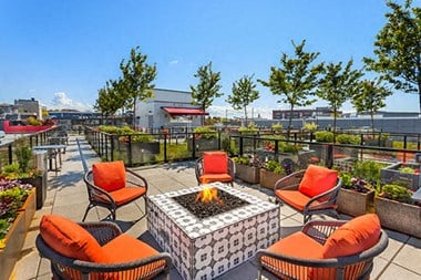 Outdoor fireplace on the rooftop patio overlooking Seattle