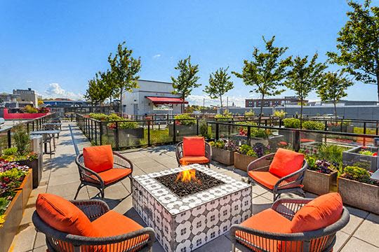 Outdoor fireplace on the rooftop patio overlooking Seattle - Photo Gallery 1