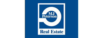 A logo for MJ Peterson Real Estate.