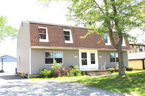 A house with a red roof and a white door.