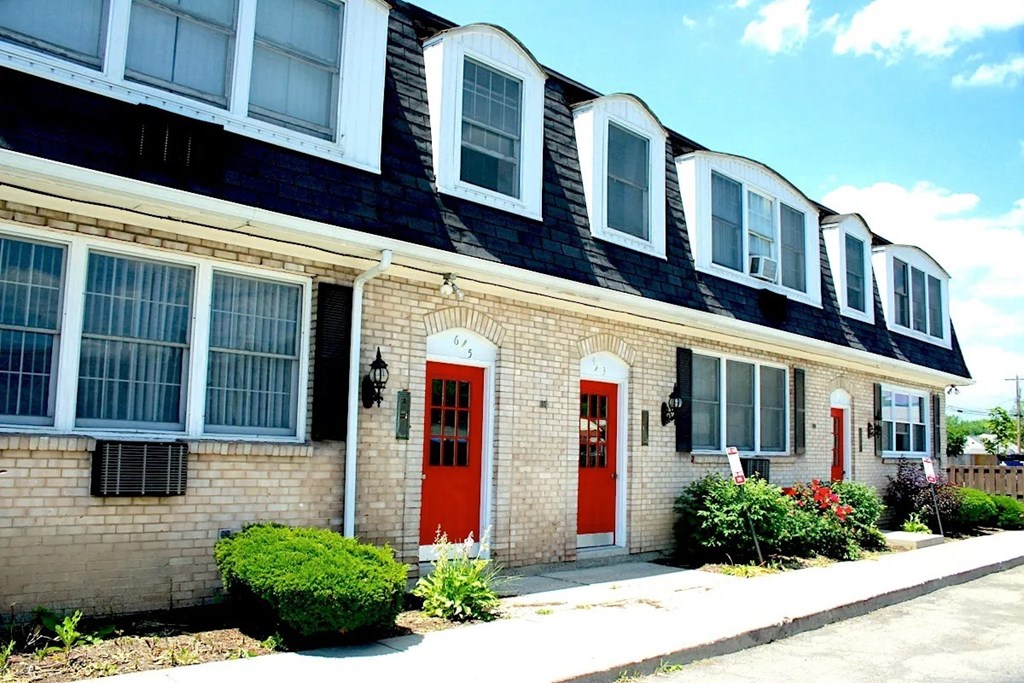 A house with a red door and windows.