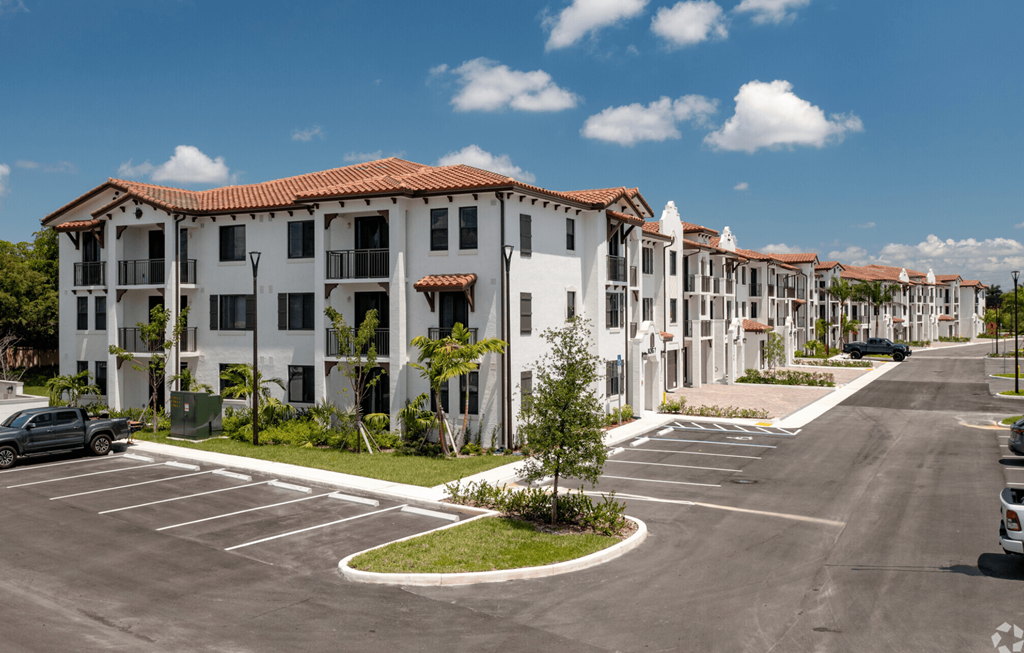 a row of apartment buildings on a street