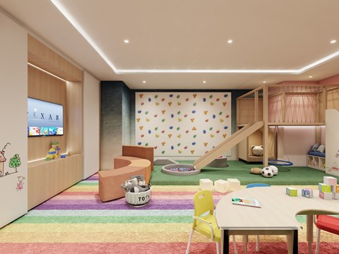 A colorful children's playroom with a slide, toys, and a rainbow carpet.