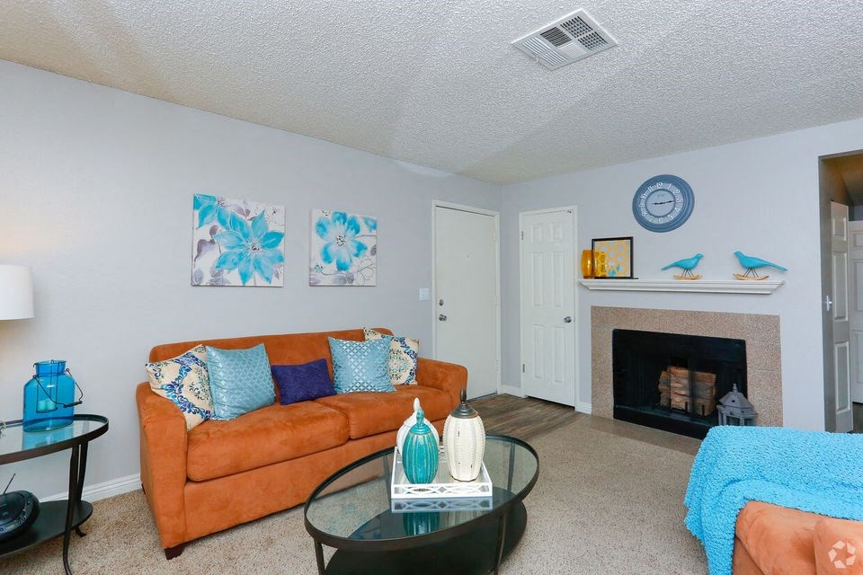a living room with a couch and a fireplace