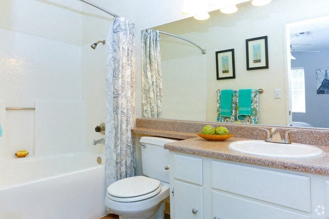 a bathroom with a sink toilet and a bath tub
