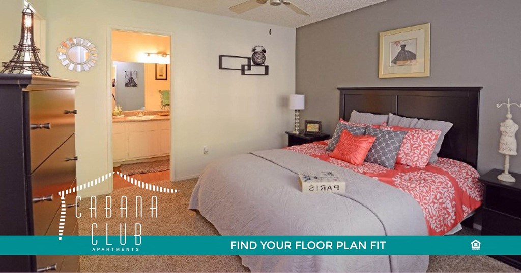 a bedroom with a bed and a closet and a bathroom