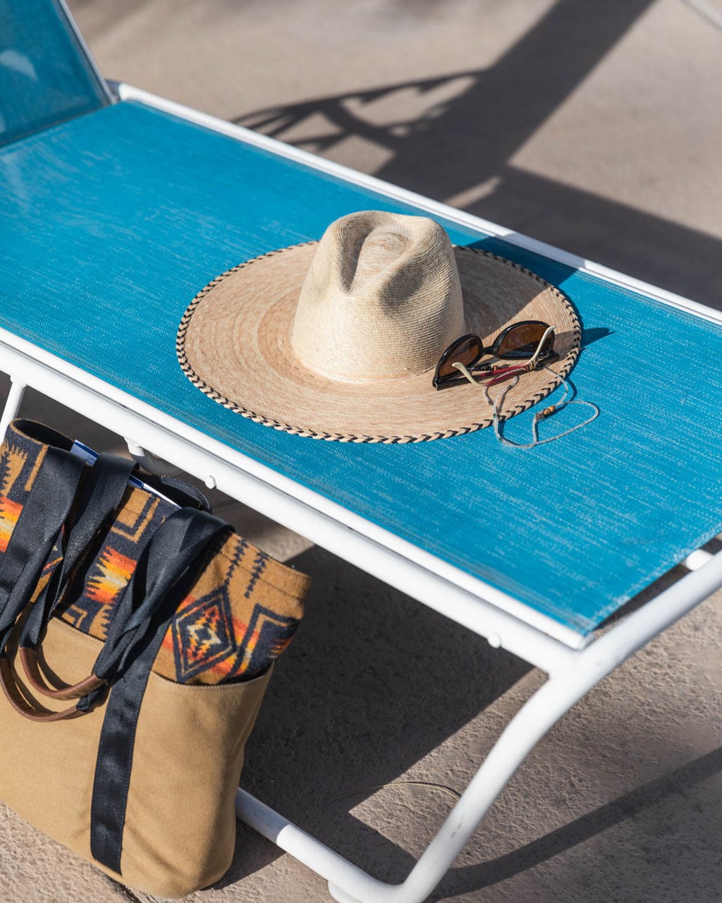a hat and sunglasses are sitting on a table