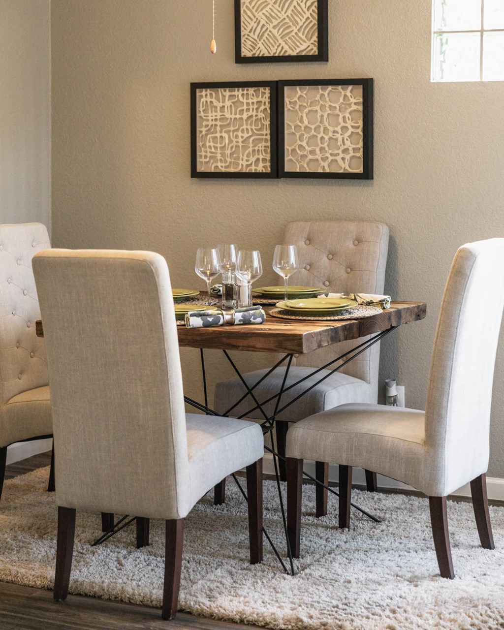 a dining room with a table and chairs