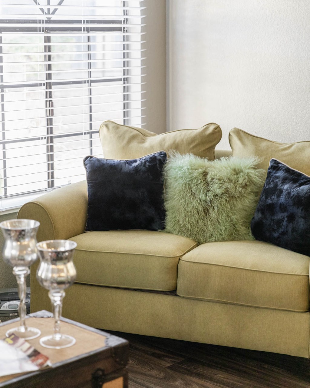 a living room with a couch and pillows on it