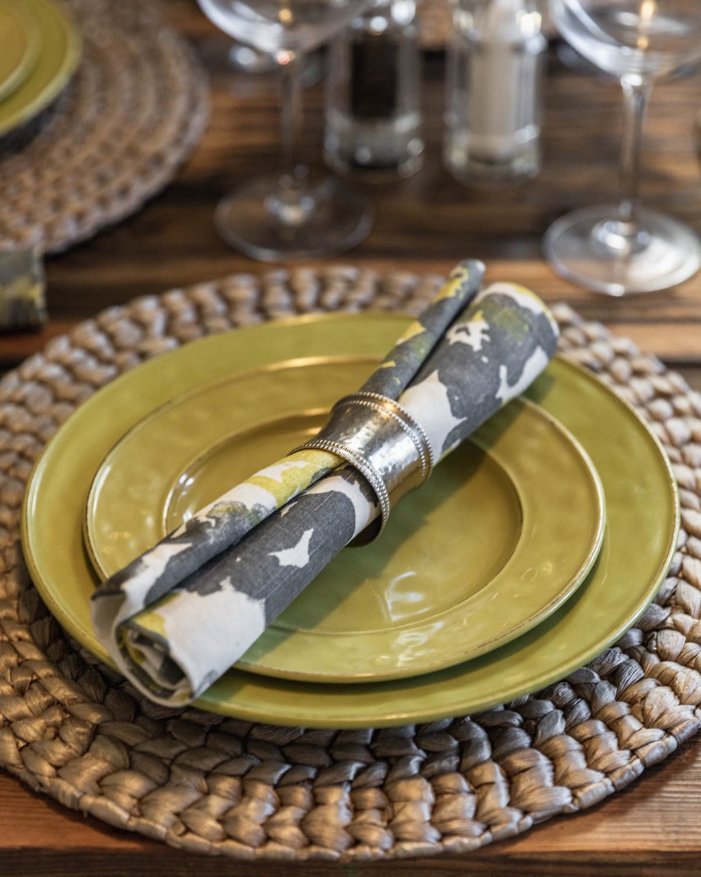 a knife on a yellow plate with a napkin on it