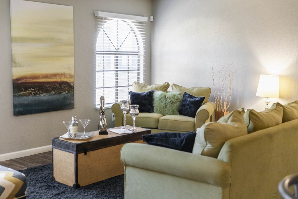 a living room with couches and a coffee table