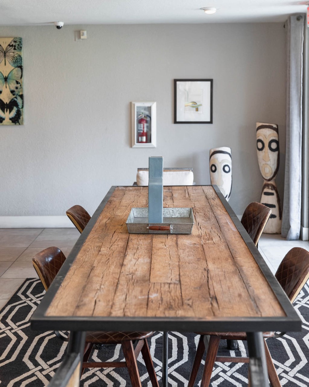 a dining room table with a remote control on it
