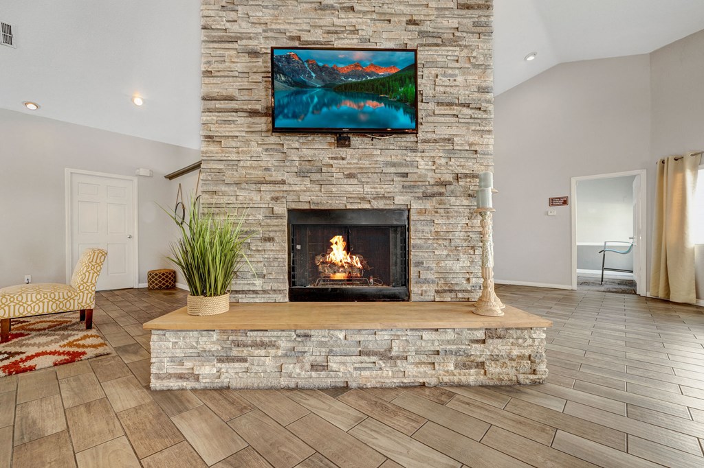 the preserve at ballantyne commons living room with fireplace and tv