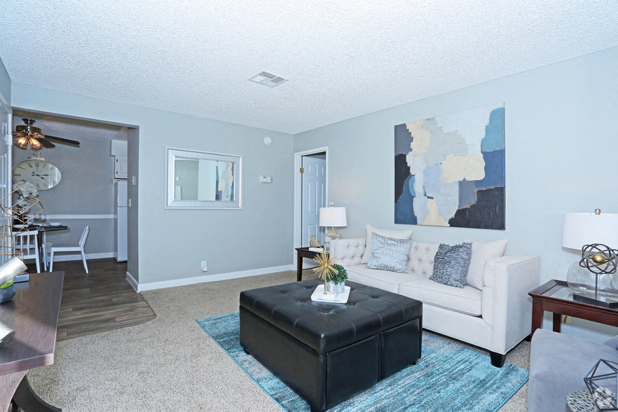 a living room with a couch and a table