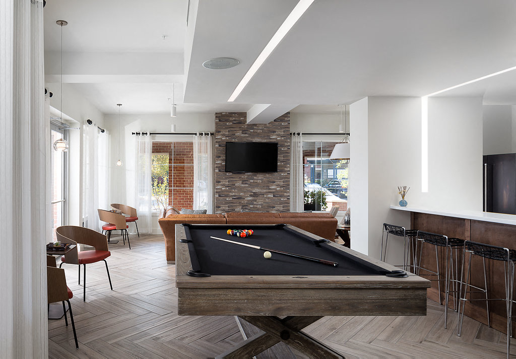 City Place at Westport Resident Clubhouse with Pool Table, TVs, and Various Seating Areas