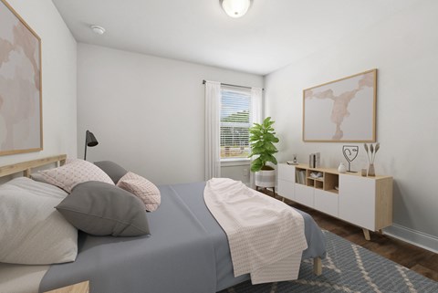 Secondary bedroom with queen size bed and large window letting in a ton of natural light.