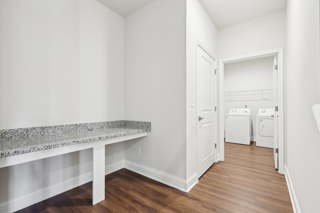Dedicated desk area with convenient access to the laundry room.