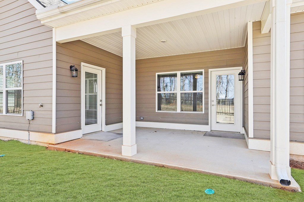 Covered patio on the exterior of the Maxton home.