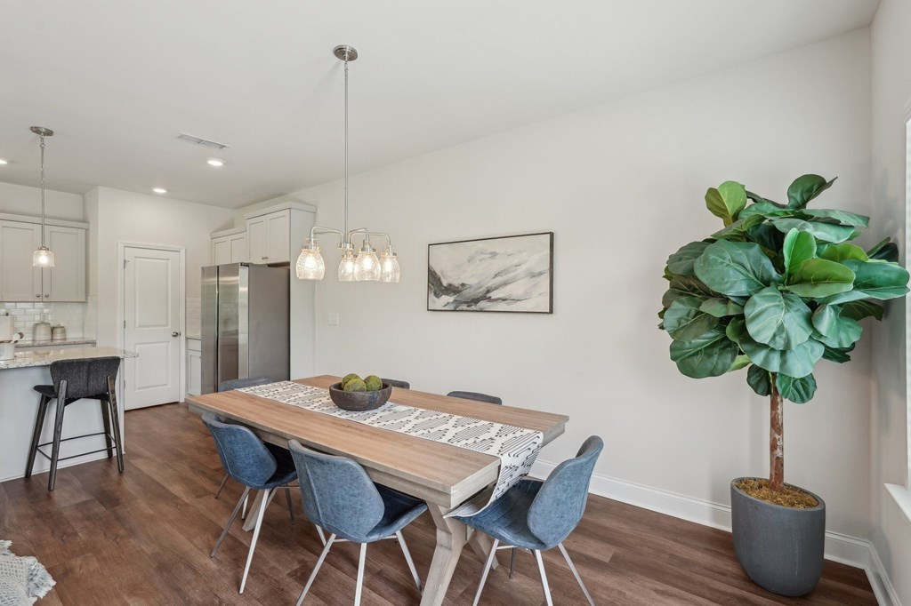 Charming dining area thoughtfully arranged for six guests.