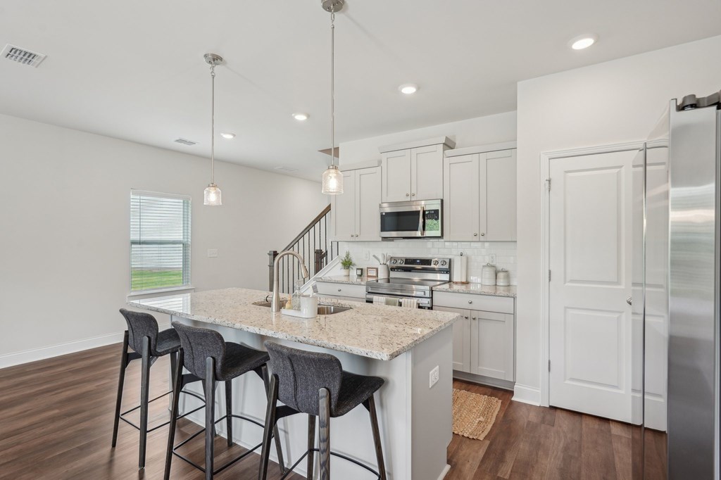 Elegant living area with a seamless view of the home’s living and dining spaces.