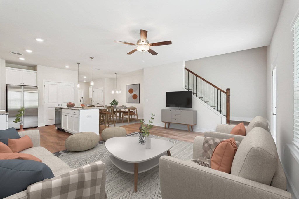 A refined living area offering a graceful view of the home’s stairwell.