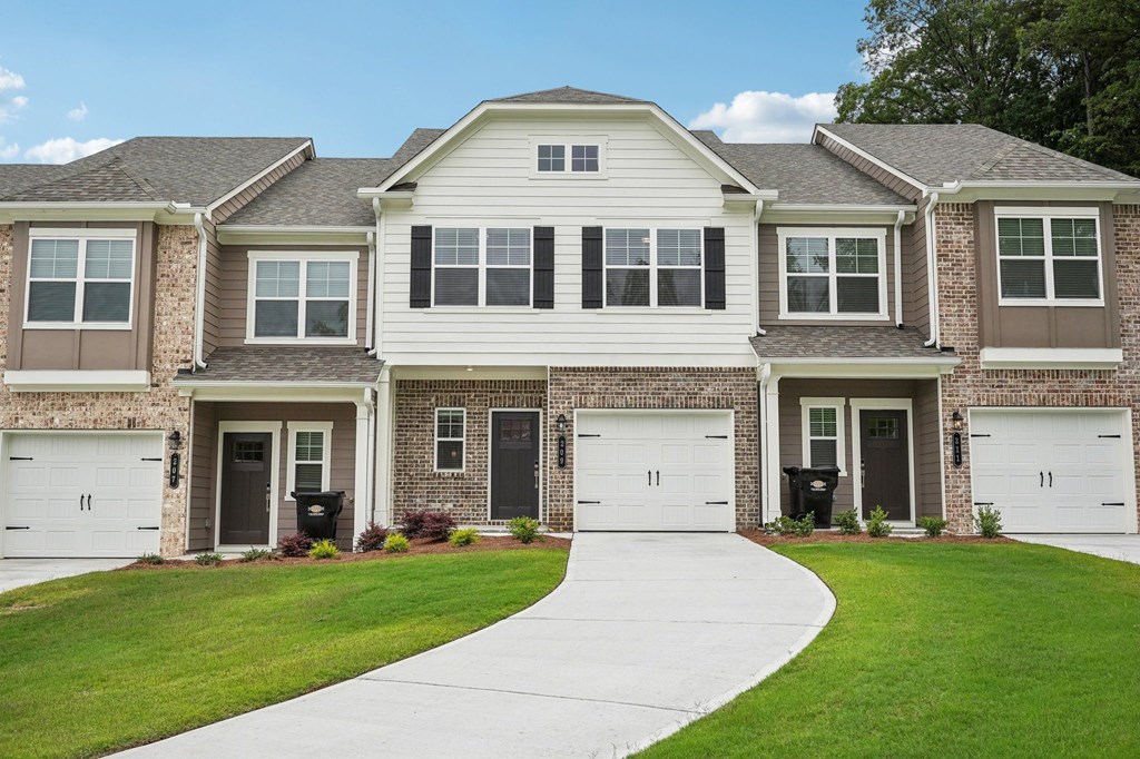 Exterior of the Monterey floorplan, two story townhome with a private driveway and attached garage.