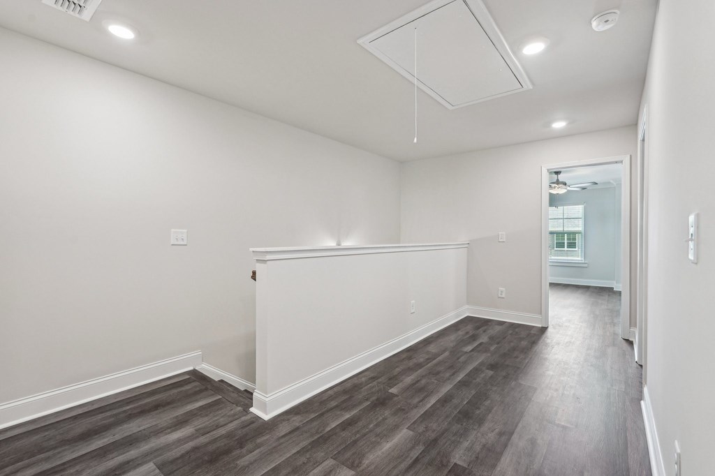 Loft area ideal for family gatherings just steps from the upstairs bedrooms.