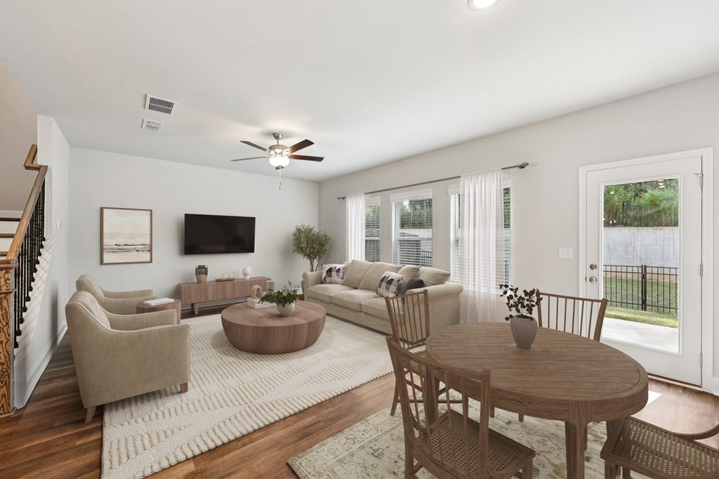 Living room with large window letting in a ton of natural light.