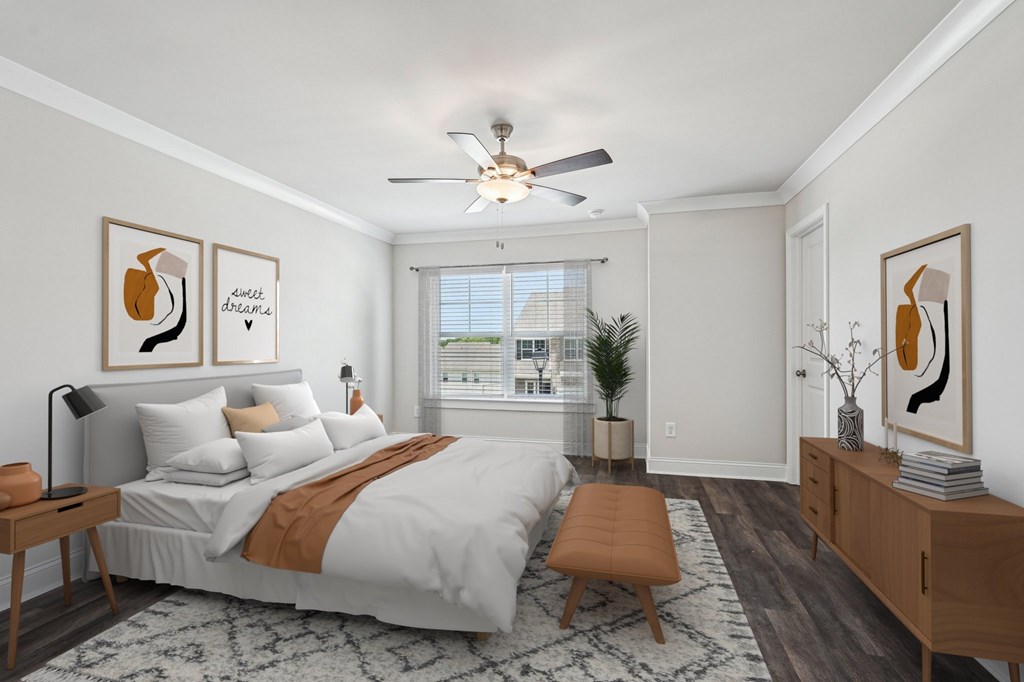 Primary Bedroom with king size bed and large window letting in nice natural light.