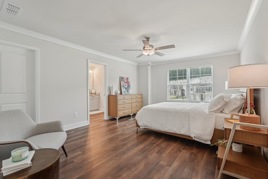 Primary Bedroom with king size bed and large window letting in nice natural light.