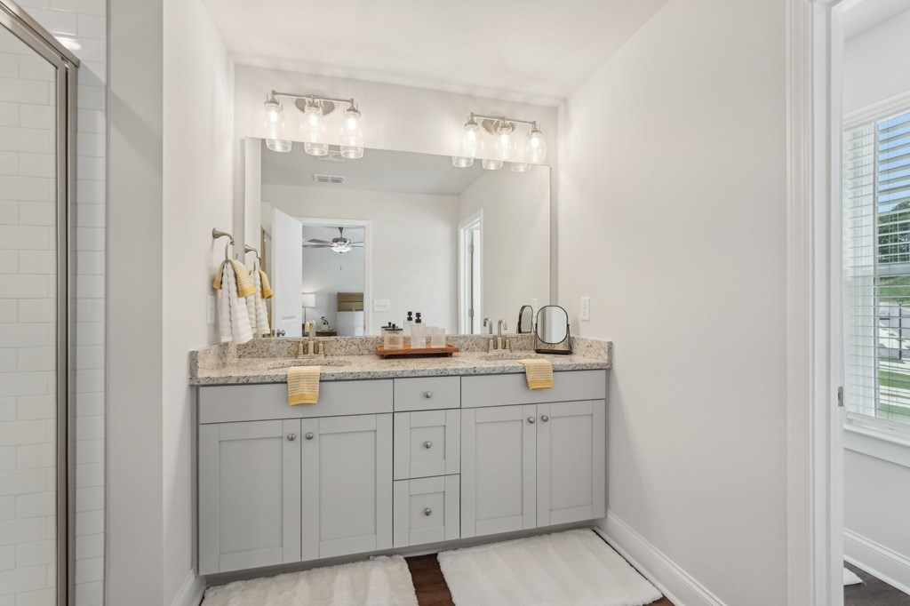 A view of the double vanity and walk in shower.