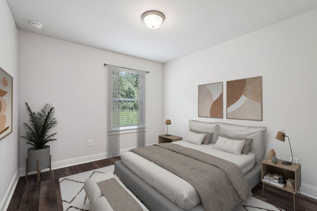Secondary bedroom with queen size bed and large window letting in a ton of natural light.