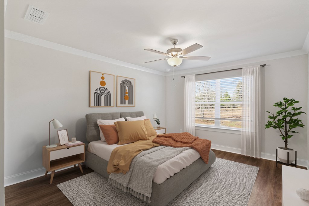 Primary Bedroom with king size bed and large window letting in nice natural light.
