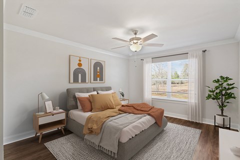 Primary Bedroom with king size bed and large window letting in nice natural light.