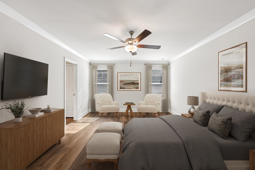 Primary Bedroom with king size bed and large window letting in nice natural light.