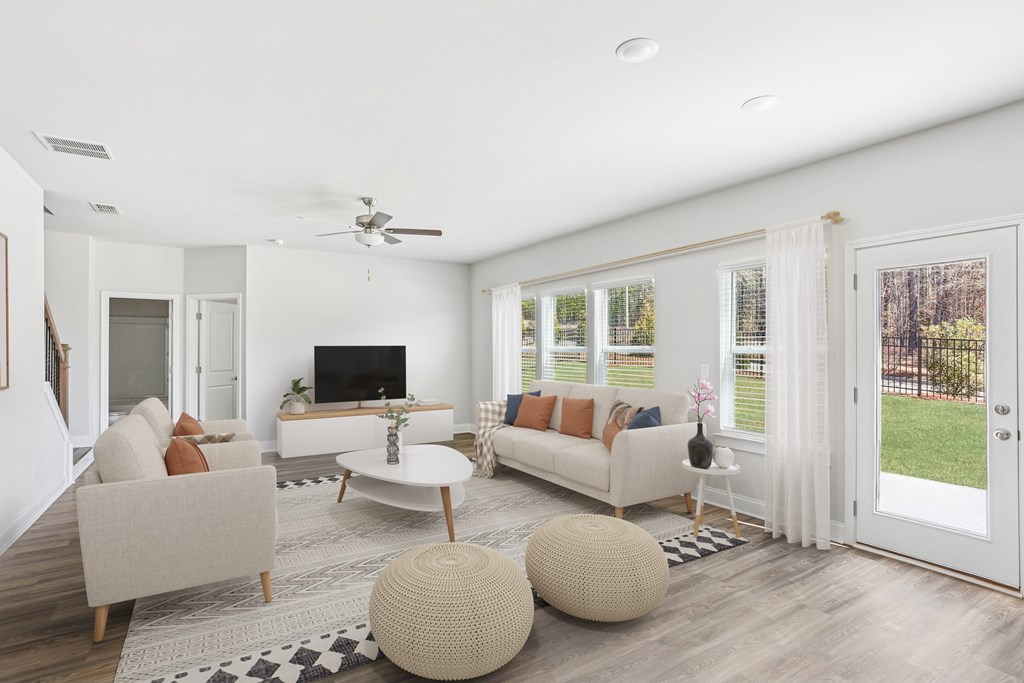 Living room with large windows and abundant natural light.