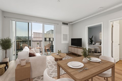 A modern living room with a dining table set for two.