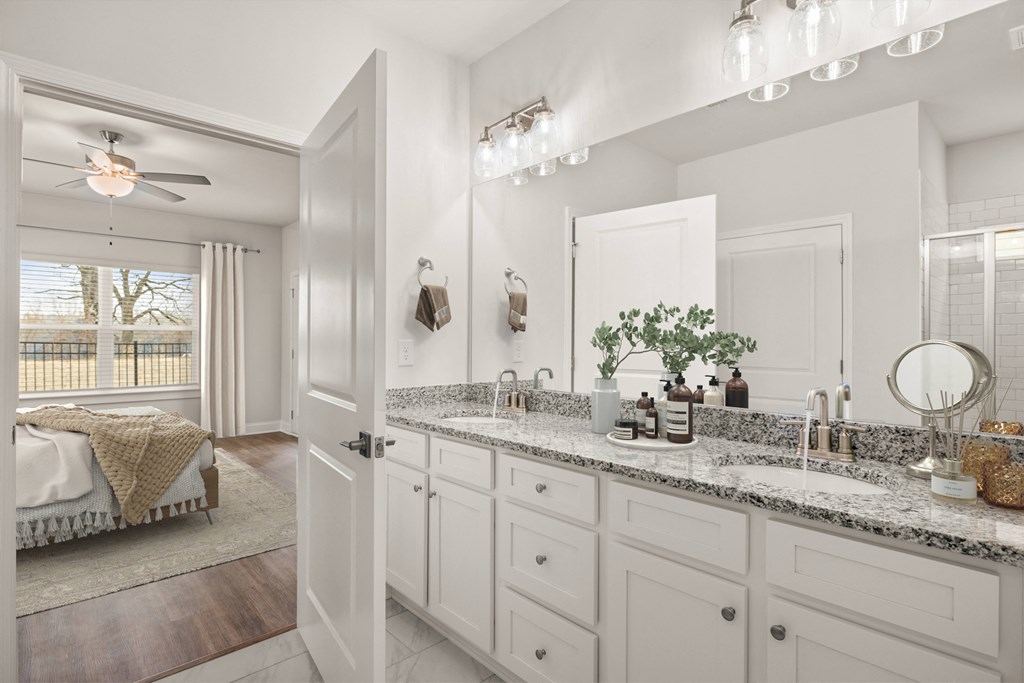 Elegant en suite with a double vanity off the primary bedroom.