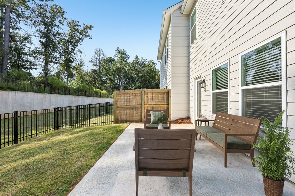 A private fenced patio offering an elegant outdoor retreat.