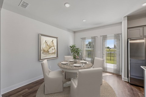 The intimate dining space elegantly set for four
