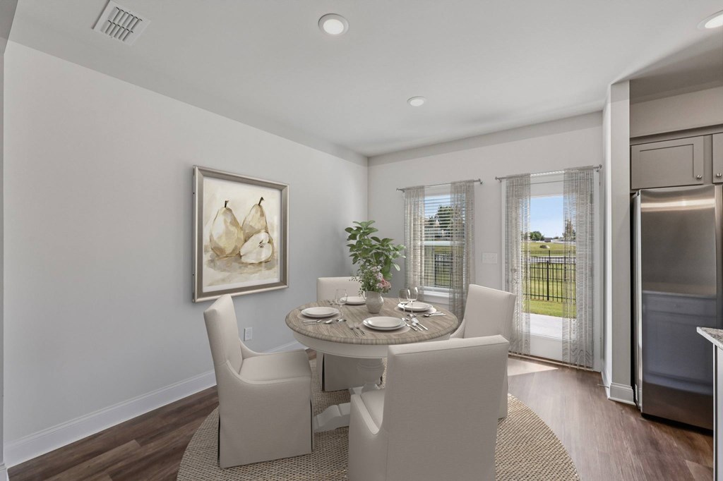 The intimate dining space elegantly set for four