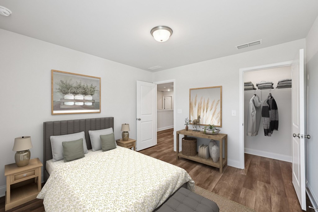 Secondary bedroom with a large bed and a wooden nightstand.