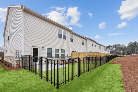Back patio with fenced in yard.
