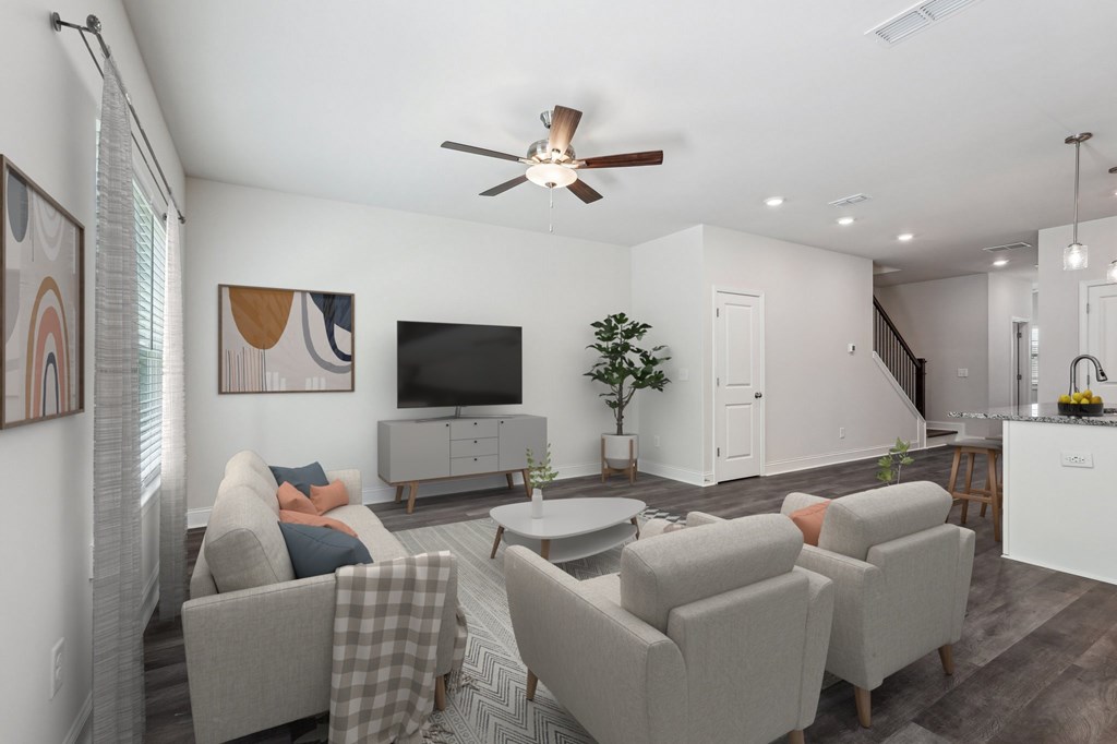 Living room with large window letting in a ton of natural light.