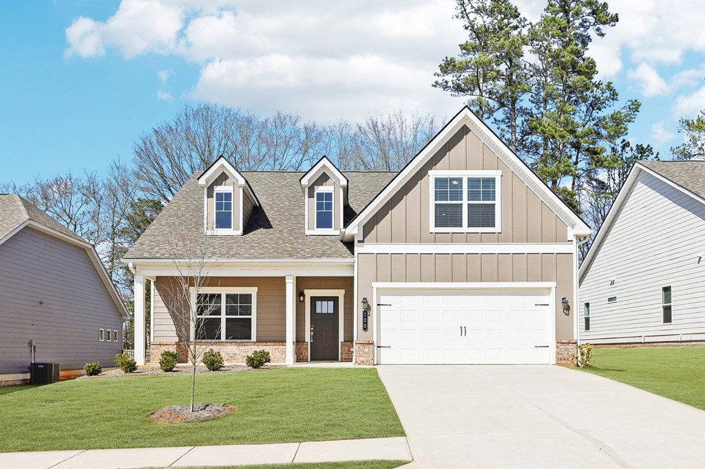 Exterior of the Melrose, two story home with a private driveway and attached garage.