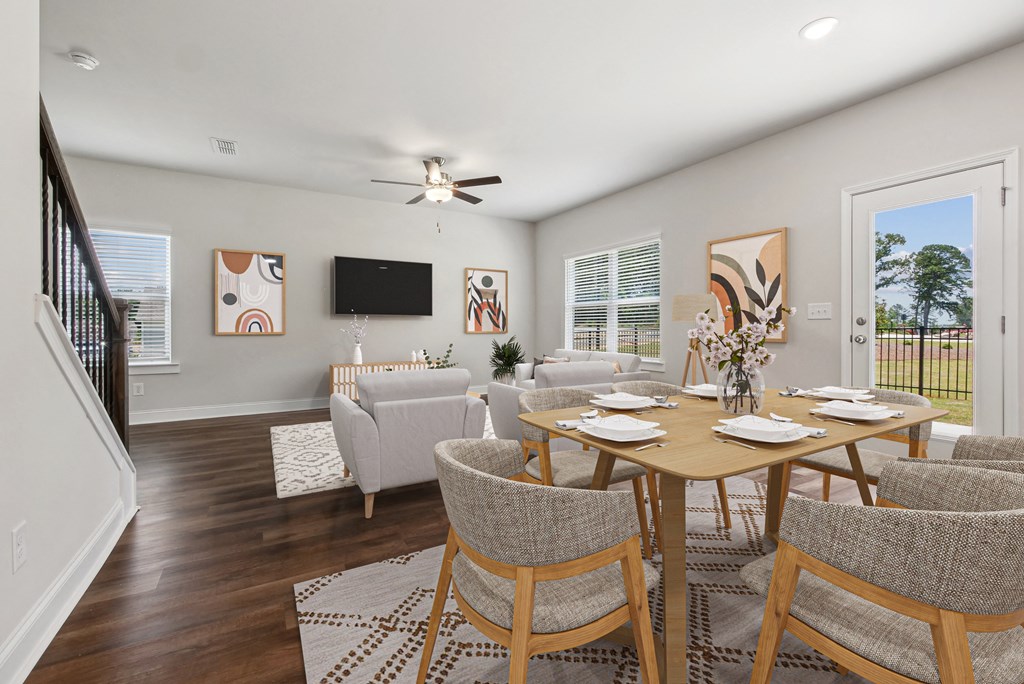 4-bedroom single family home with open-concept floor plans. The kitchen dining room is open to the living room with recessed lighting and ceiling fan.