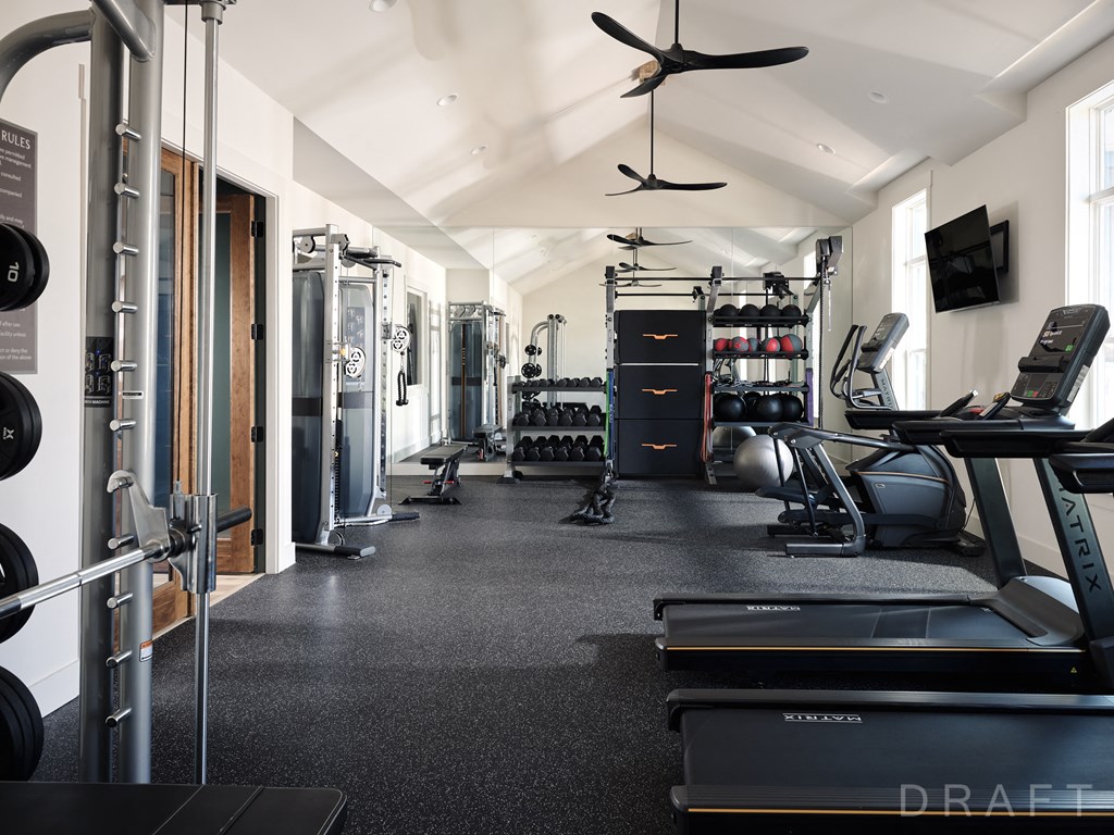 a gym with treadmills and other exercise equipment